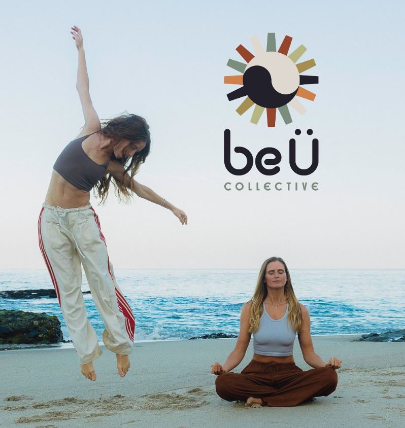 Two women on a beach; one is meditating cross-legged, the other mid-jump with arms up under the Full Moon. The "beÜ Collective" logo is displayed above them, capturing a moment of Radiant Reset.